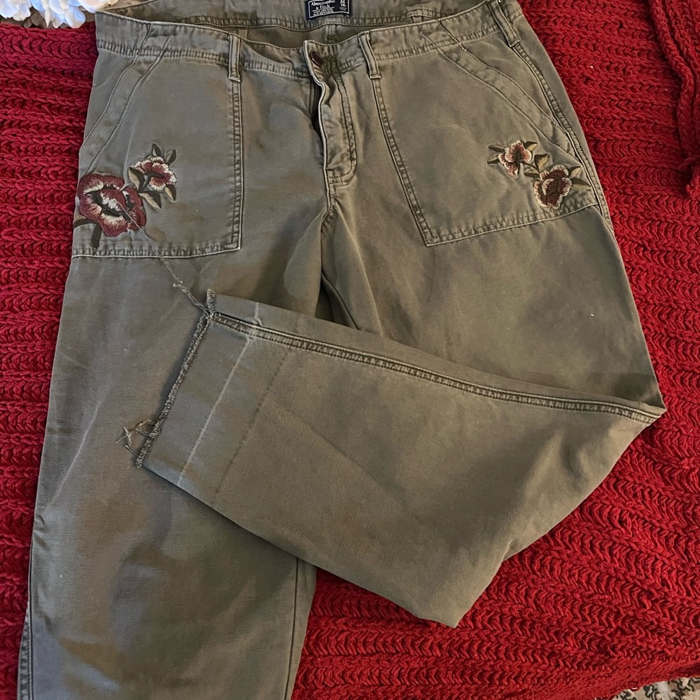 Army green distressed capris pants.